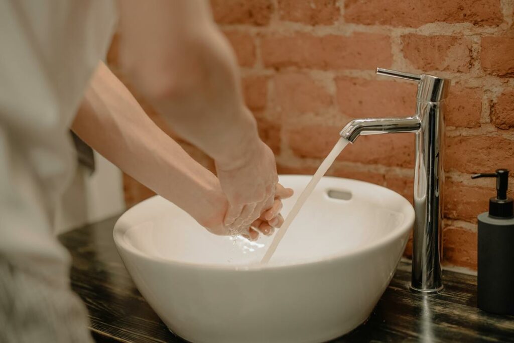 Person Washing Hands