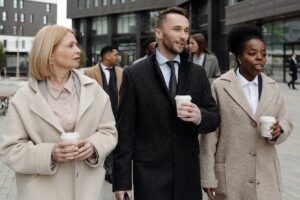 Coworkers Walking and Taking a Coffee Break