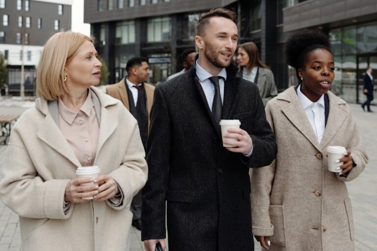 Coworkers Walking and Taking a Coffee Break